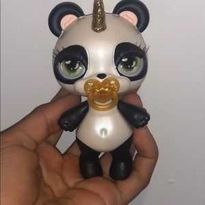 Poopsie (panda) doll, plus extra bracelet.
